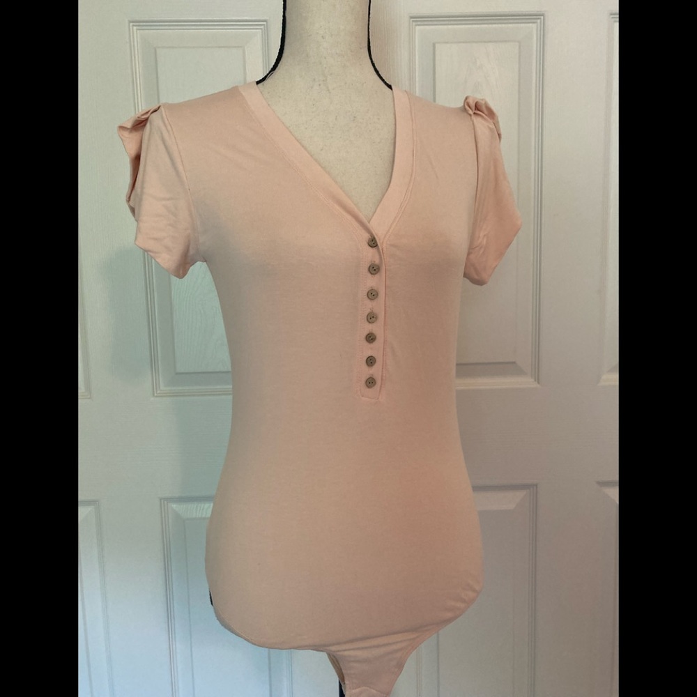 Cute soft pink bodysuit by Ella Blue size large. BNWT